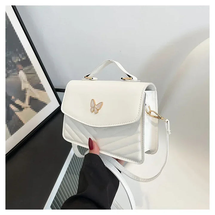 Faux leather bag with butterfly decoration