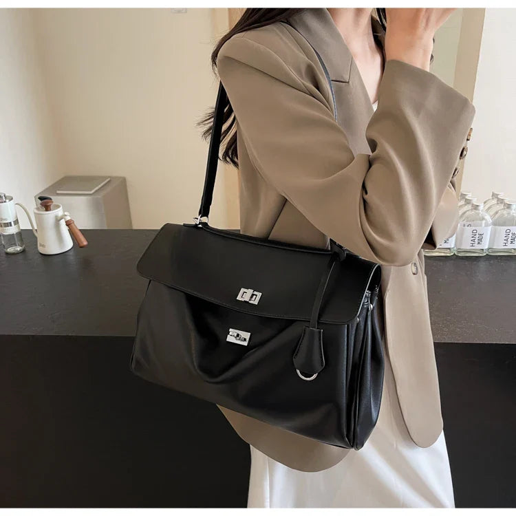 Leather bag with buckle closure