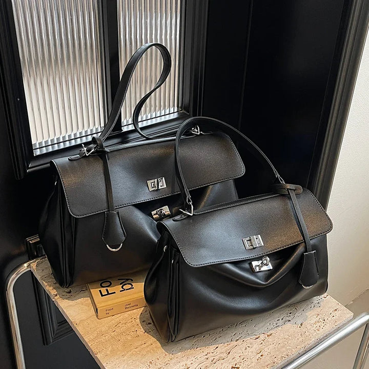 Leather bag with buckle closure
