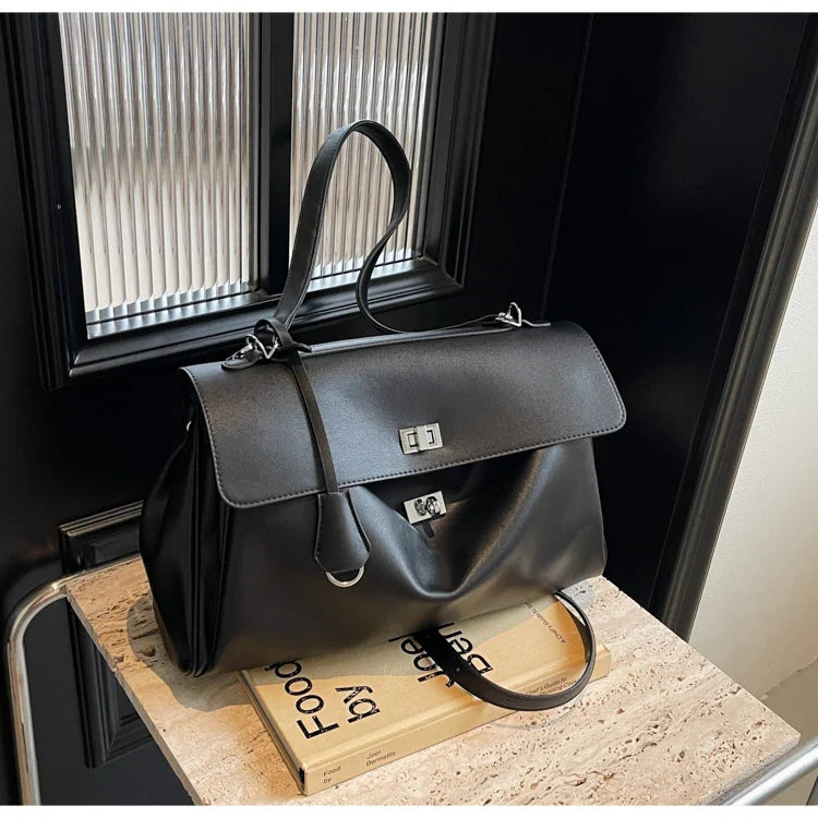 Leather bag with buckle closure