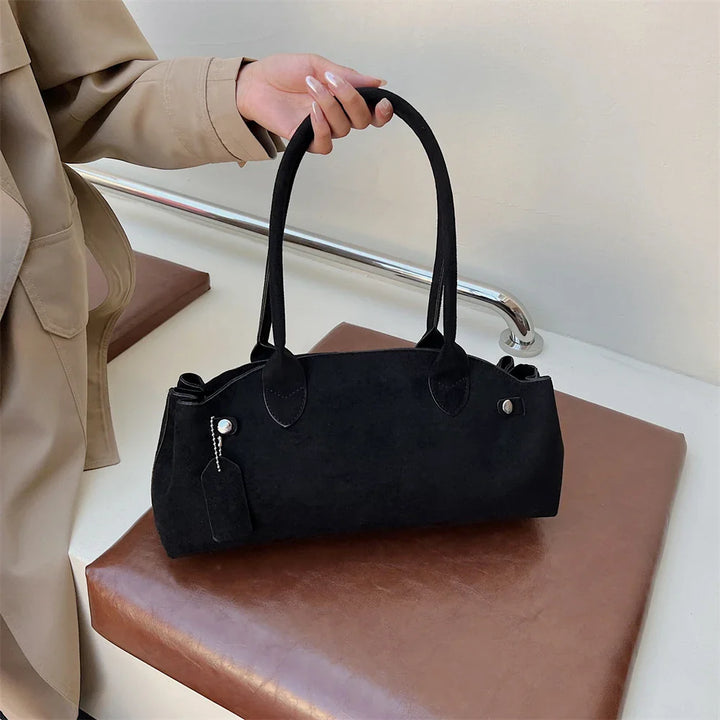 Suede bag with retro design
