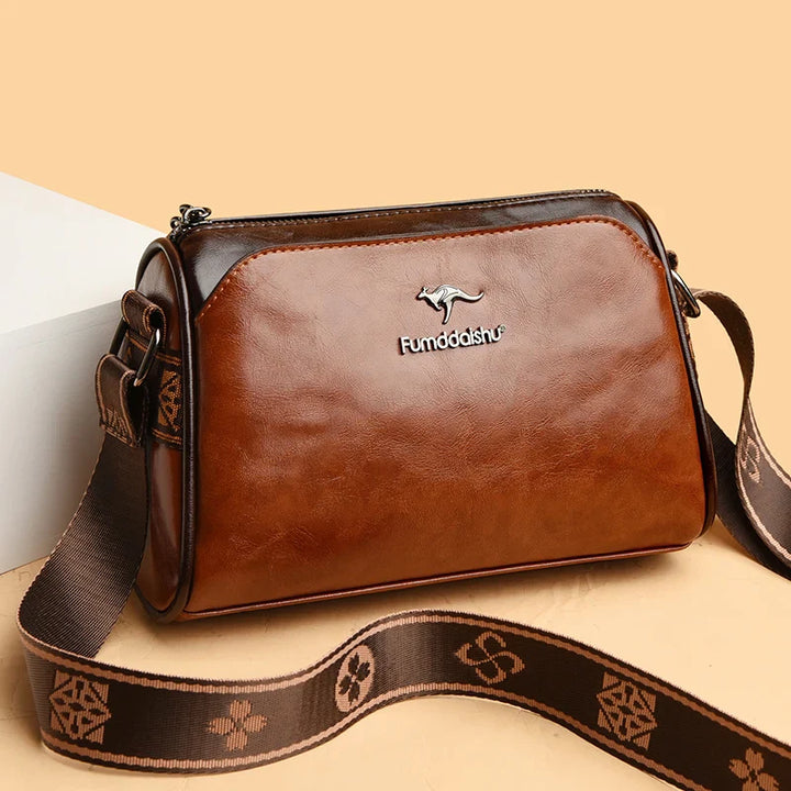 Faux leather bag with strap design