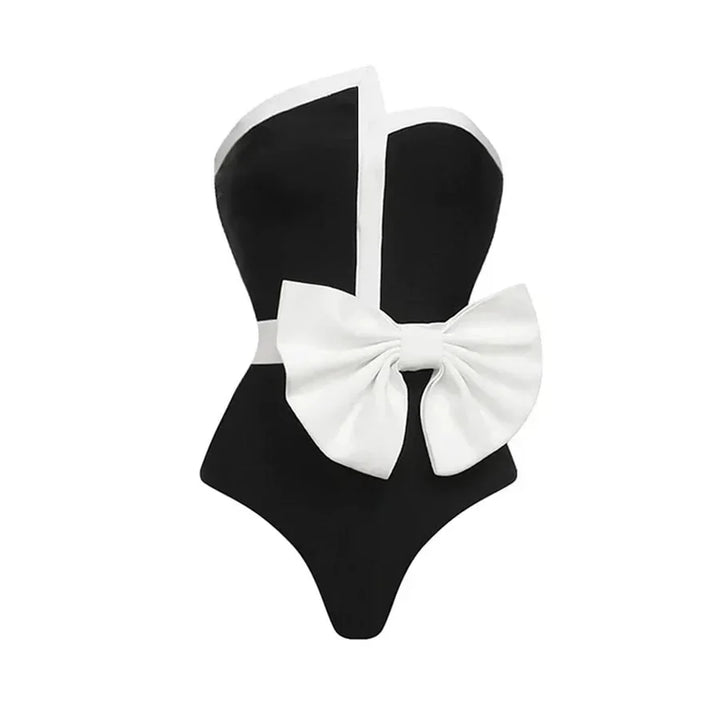 One-piece strapless swimsuit in a luxurious asymmetrical design with bow tie decoration combined with a matching skirt in monochrome colors - Gabriella