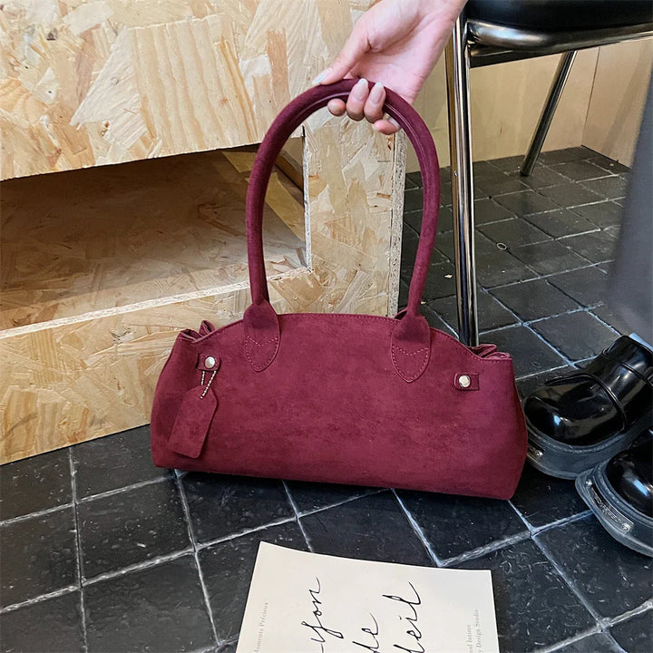 Suede bag with retro design