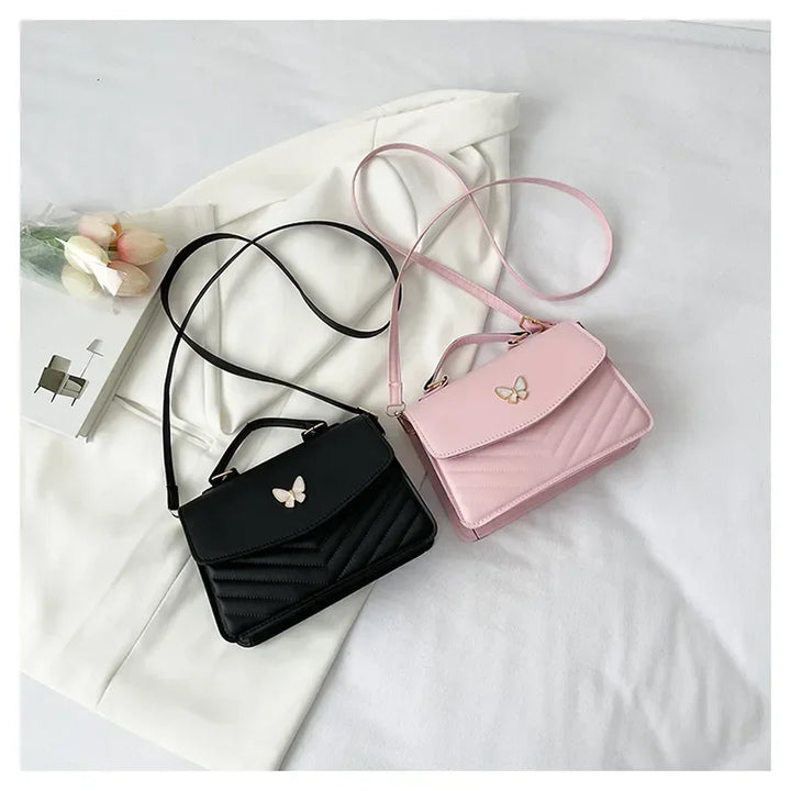Faux leather bag with butterfly decoration