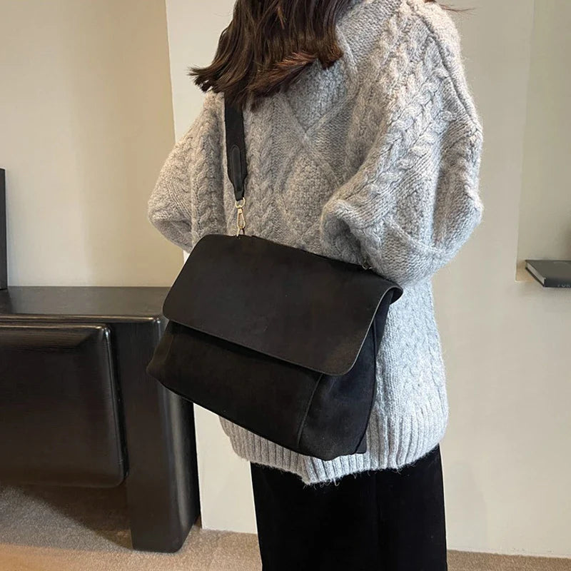 Suede bag with retro design