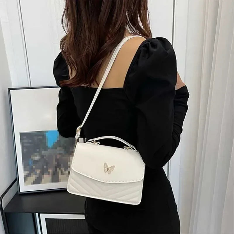 Faux leather bag with butterfly decoration