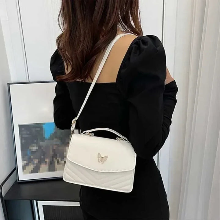 Faux leather bag with butterfly decoration