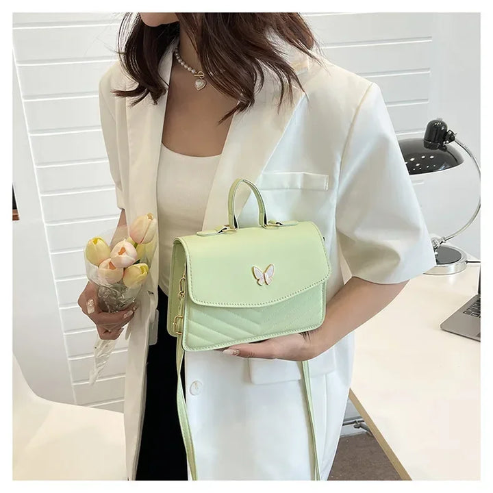 Faux leather bag with butterfly decoration