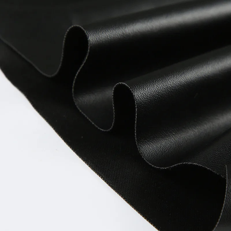 Faux leather top with asymmetrical design - Kami