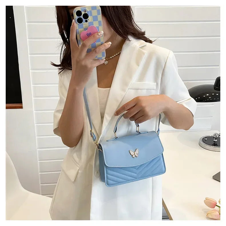Faux leather bag with butterfly decoration