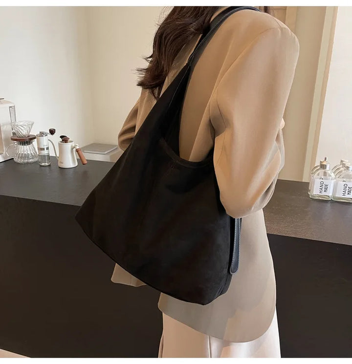 Suede bag with retro design
