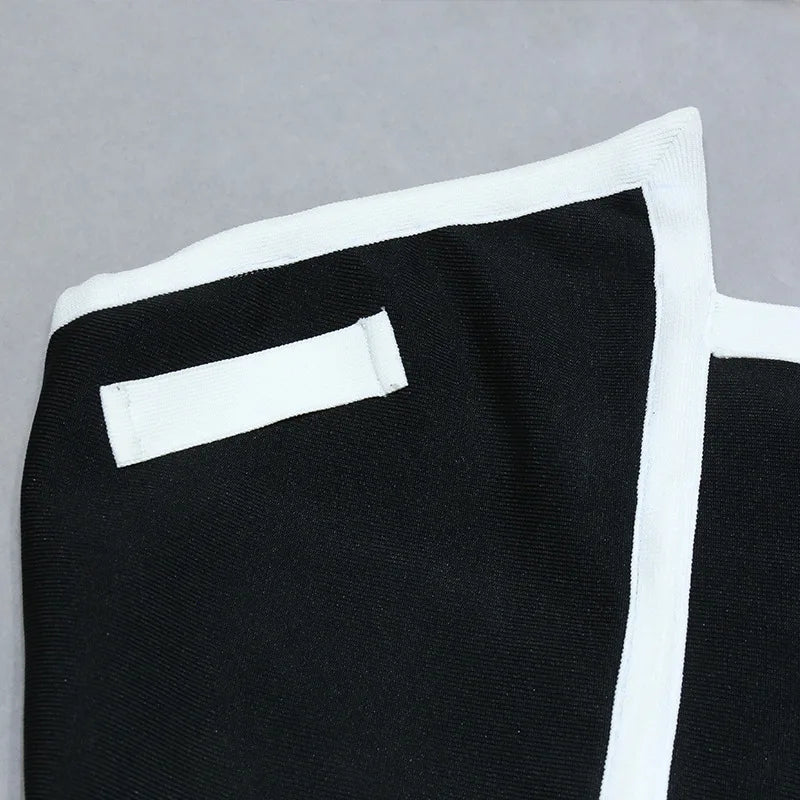 One-piece strapless swimsuit in a luxurious asymmetrical design with bow tie decoration combined with a matching skirt in monochrome colors - Gabriella