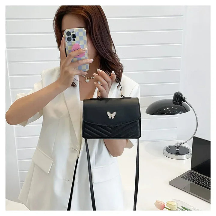 Faux leather bag with butterfly decoration