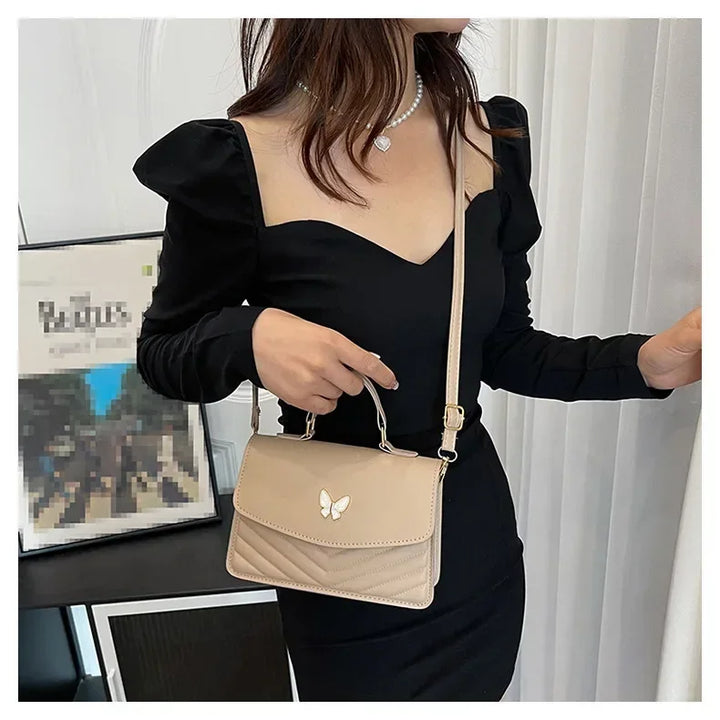 Faux leather bag with butterfly decoration