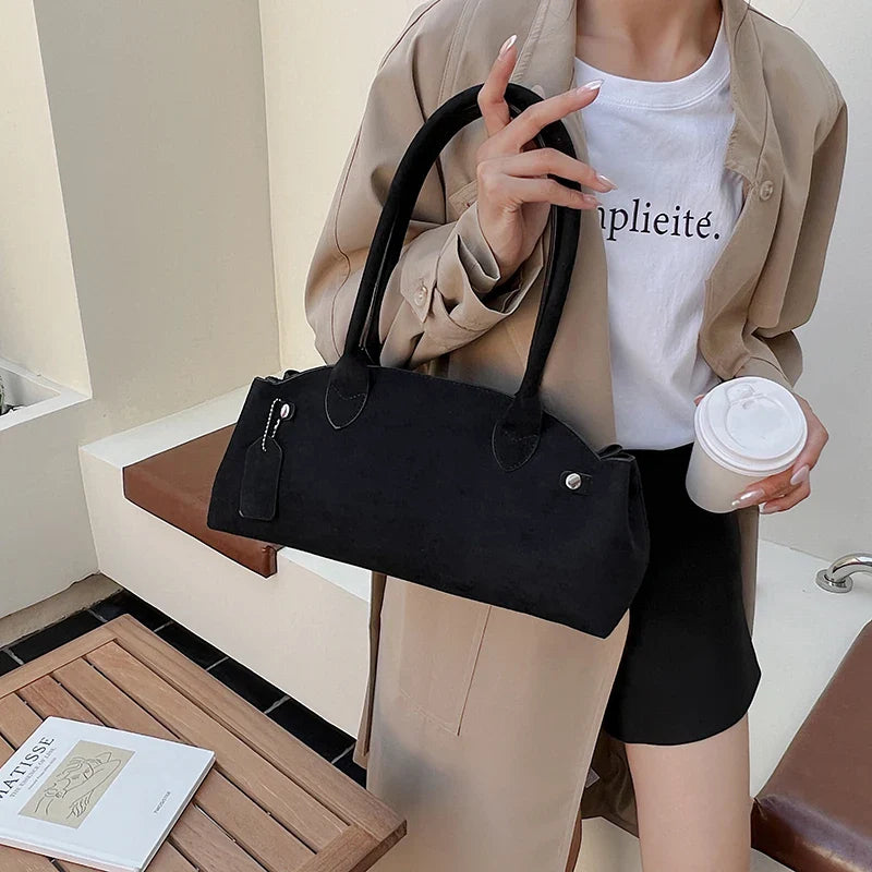 Suede bag with retro design