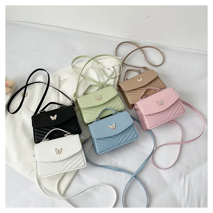 Faux leather bag with butterfly decoration