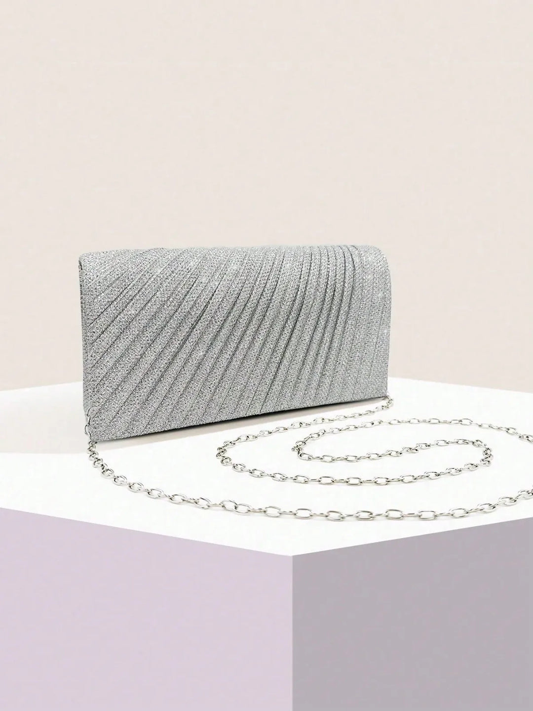 Clutch bag with sparkling studs and chain strap design