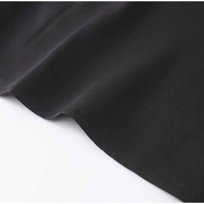 שמלת מיני מחויטת בגזרת שעון חול בעיטור כיסים - נילס