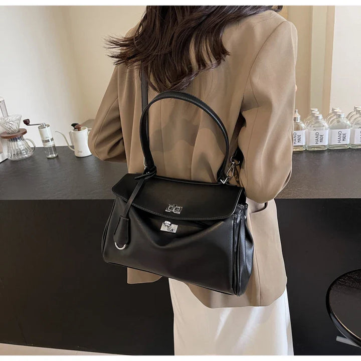 Leather bag with buckle closure