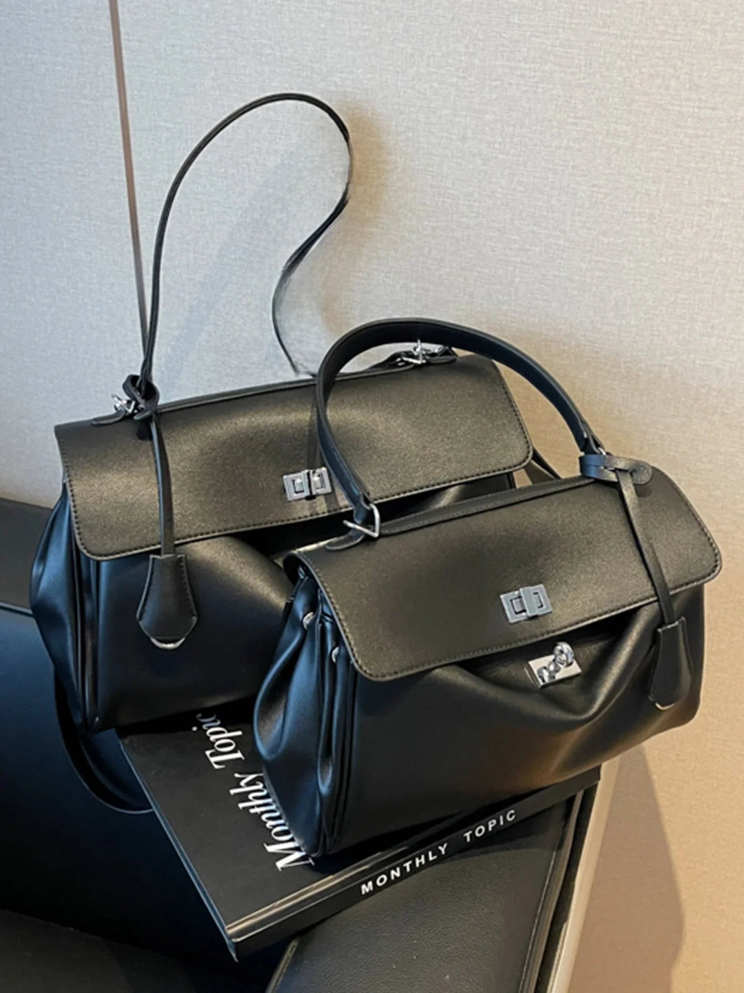 Leather bag with buckle closure