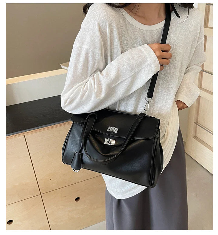 Leather bag with buckle closure