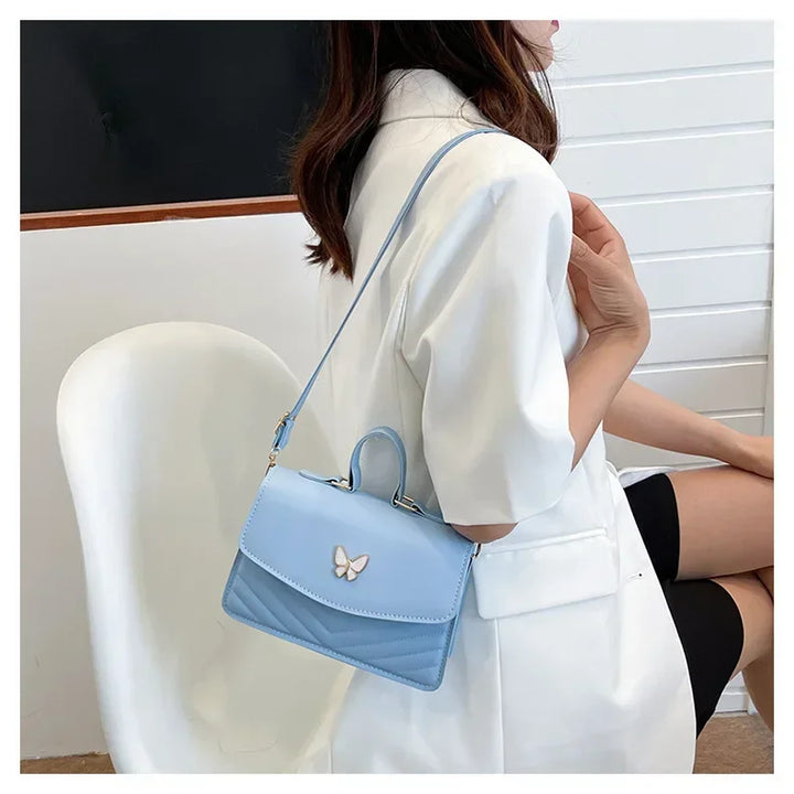 Faux leather bag with butterfly decoration