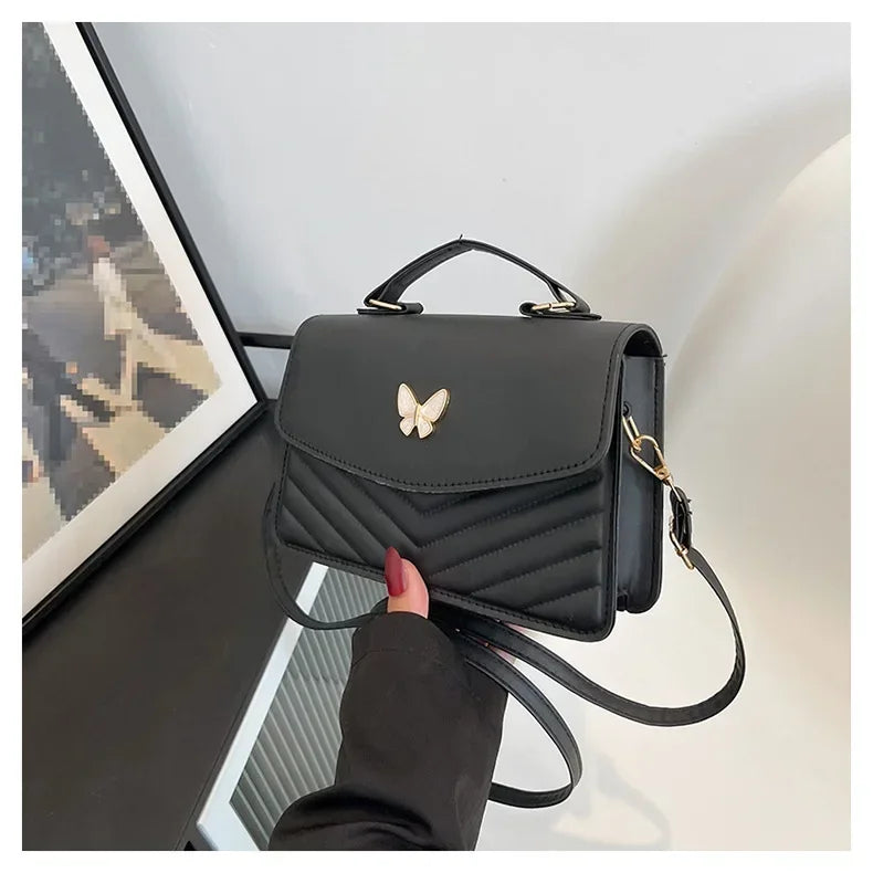 Faux leather bag with butterfly decoration