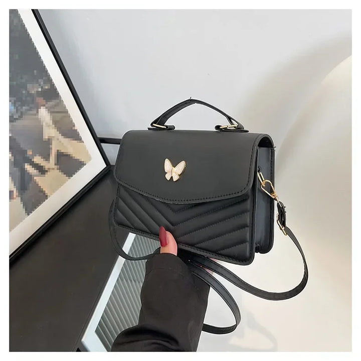 Faux leather bag with butterfly decoration