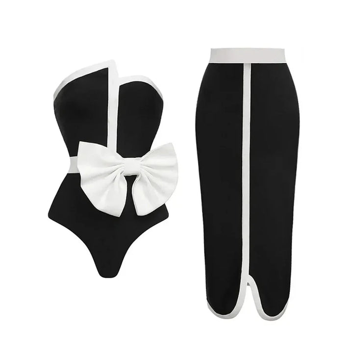 One-piece strapless swimsuit in a luxurious asymmetrical design with bow tie decoration combined with a matching skirt in monochrome colors - Gabriella