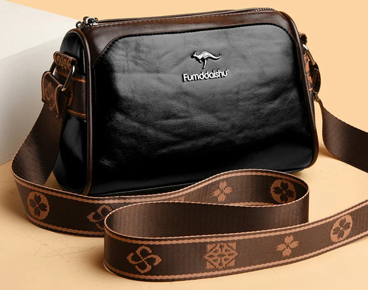 Faux leather bag with strap design