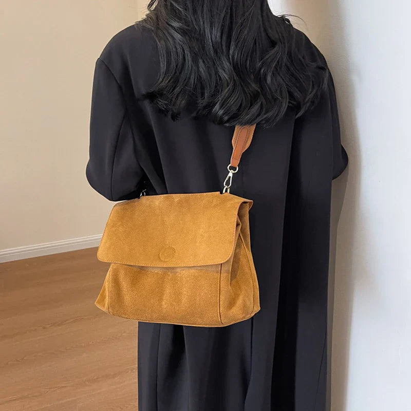 Suede bag with retro design