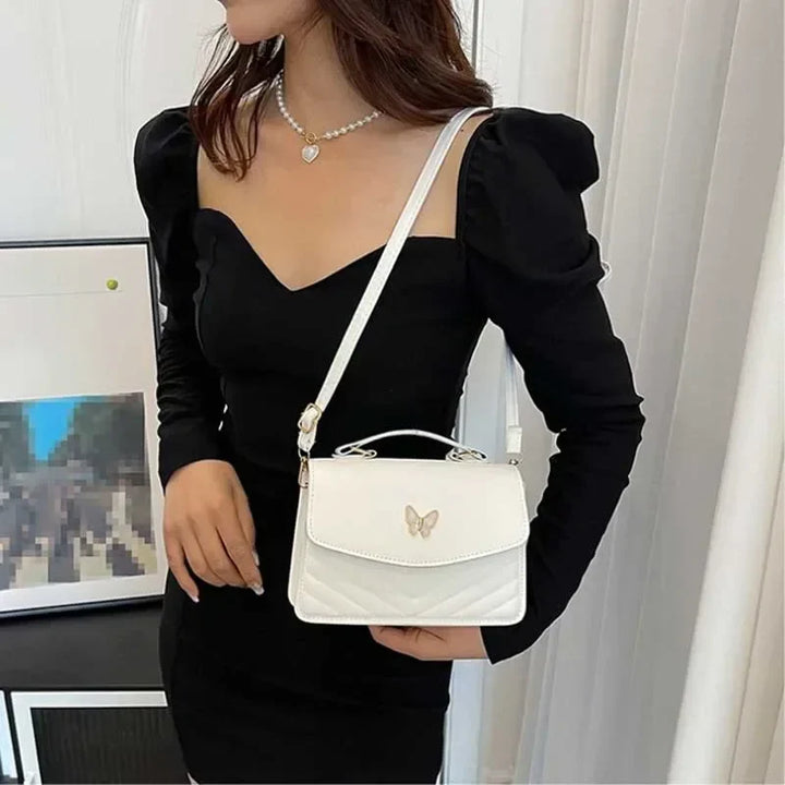 Faux leather bag with butterfly decoration