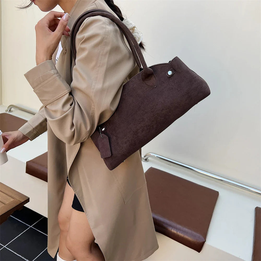 Suede bag with retro design