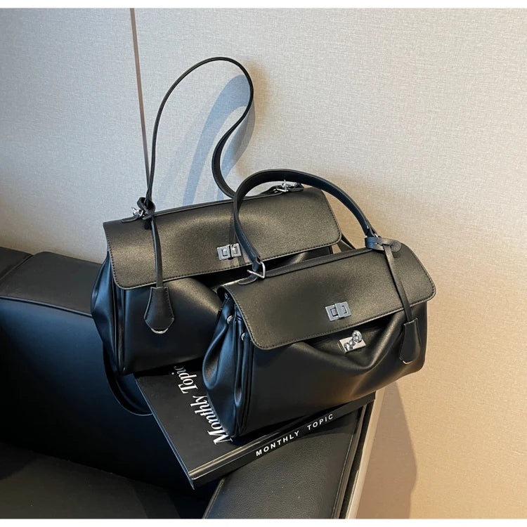 Leather bag with buckle closure