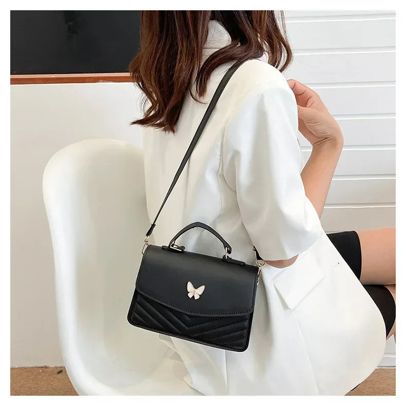 Faux leather bag with butterfly decoration