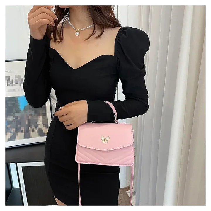 Faux leather bag with butterfly decoration