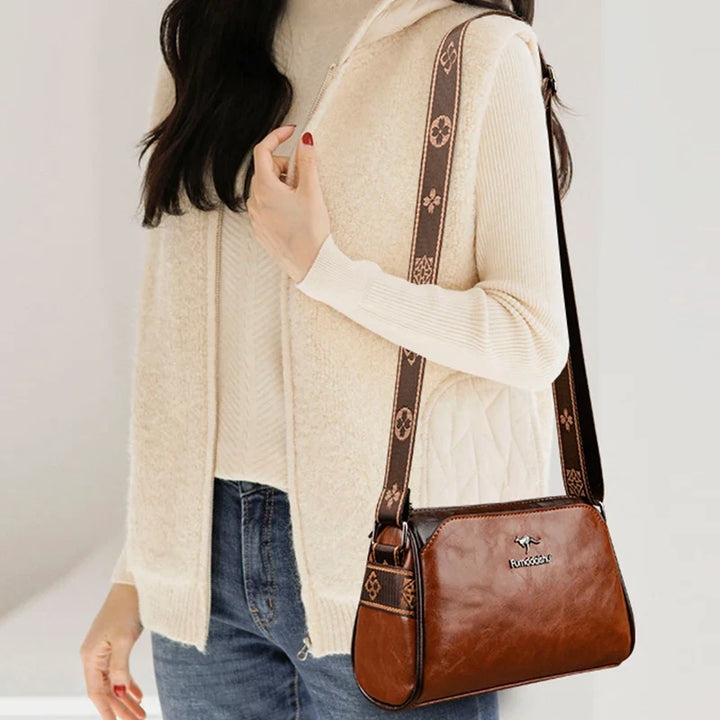 Faux leather bag with strap design
