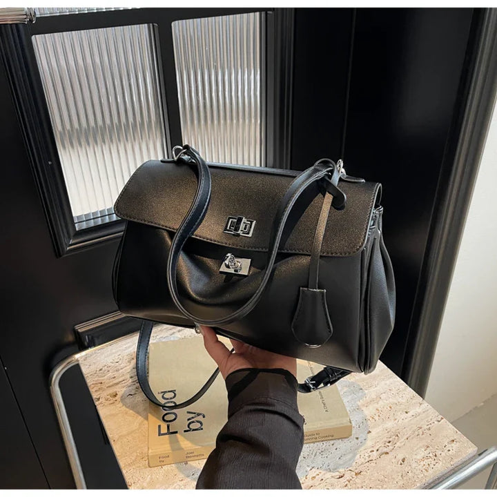 Leather bag with buckle closure