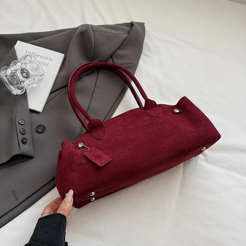 Suede bag with retro design