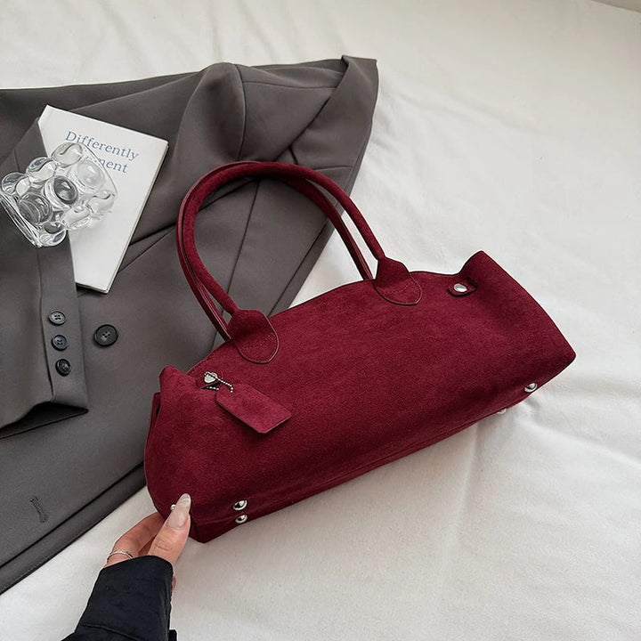 Suede bag with retro design