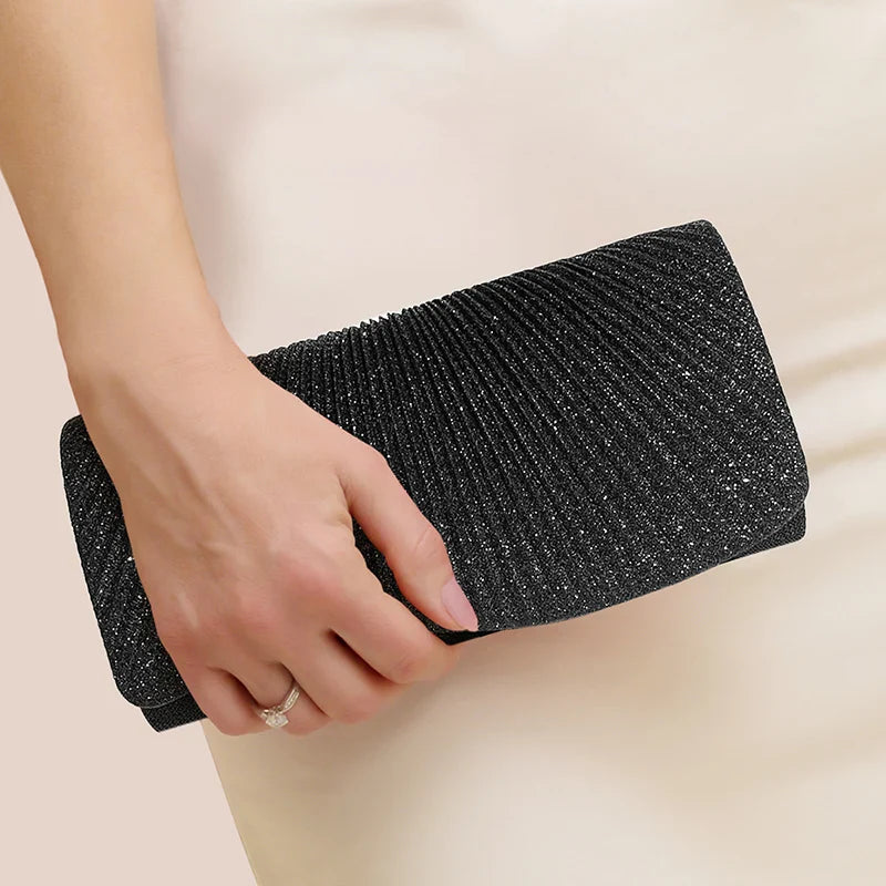 Clutch bag with sparkling studs and chain strap design