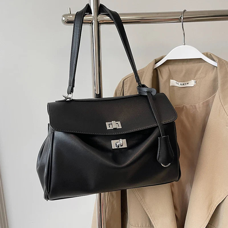 Leather bag with buckle closure