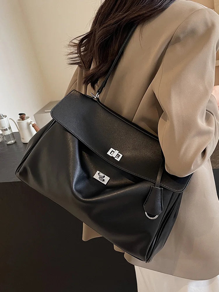 Leather bag with buckle closure
