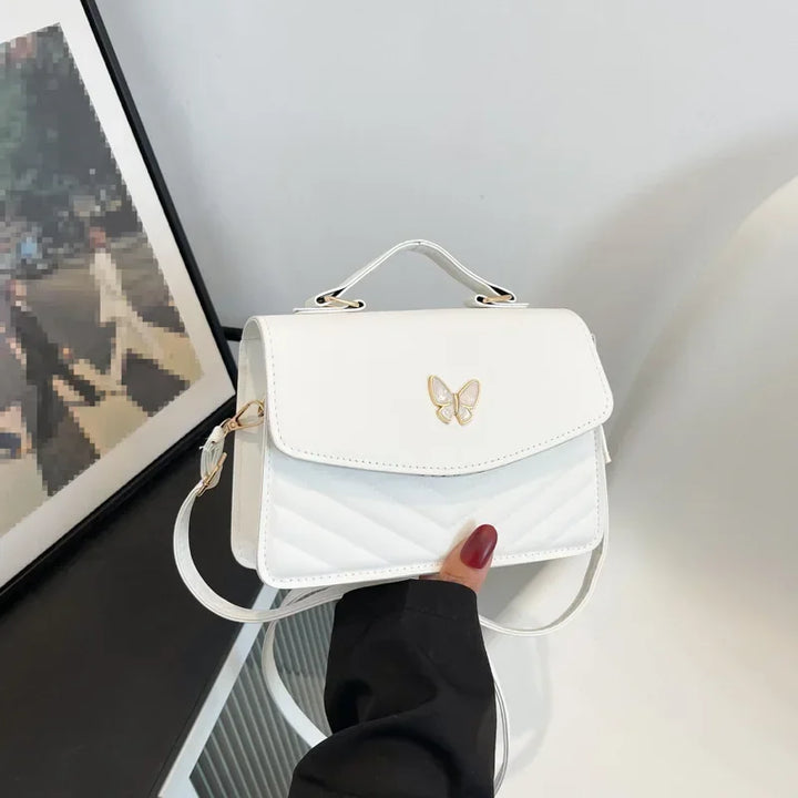 Faux leather bag with butterfly decoration