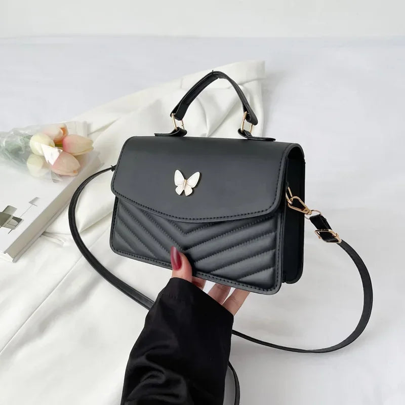 Faux leather bag with butterfly decoration