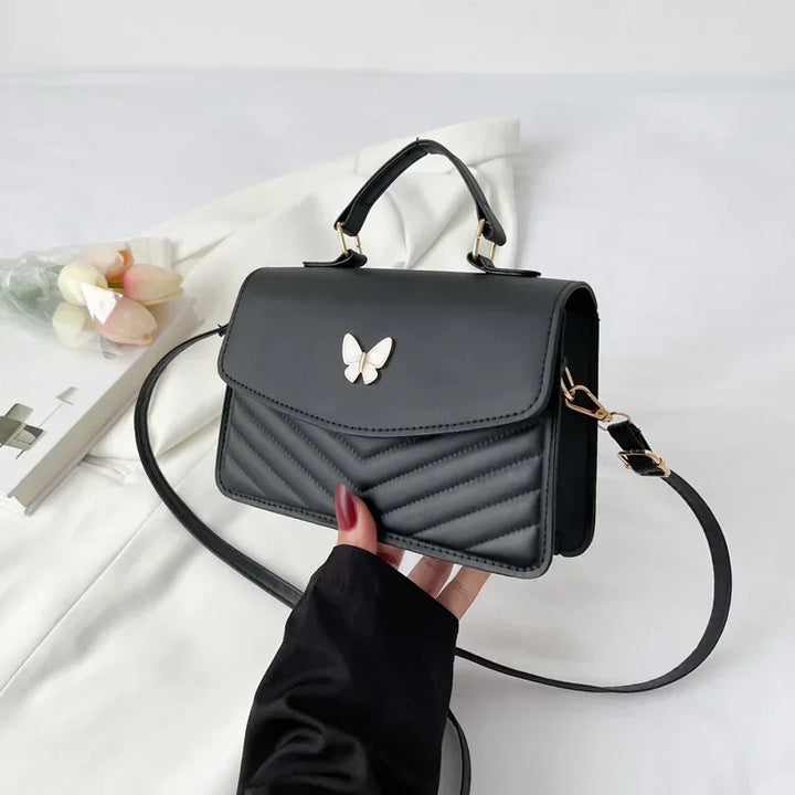 Faux leather bag with butterfly decoration