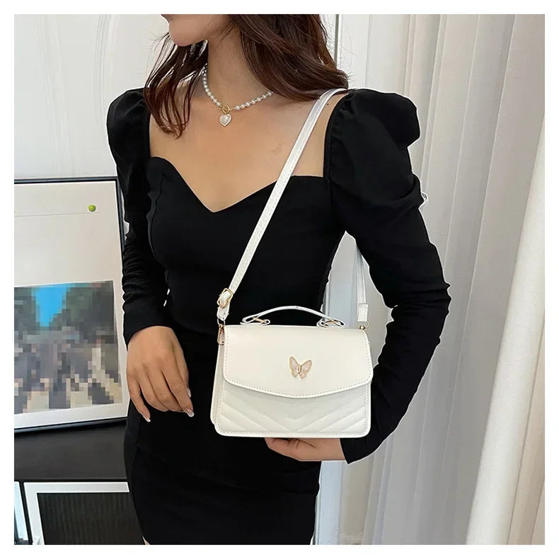 Faux leather bag with butterfly decoration