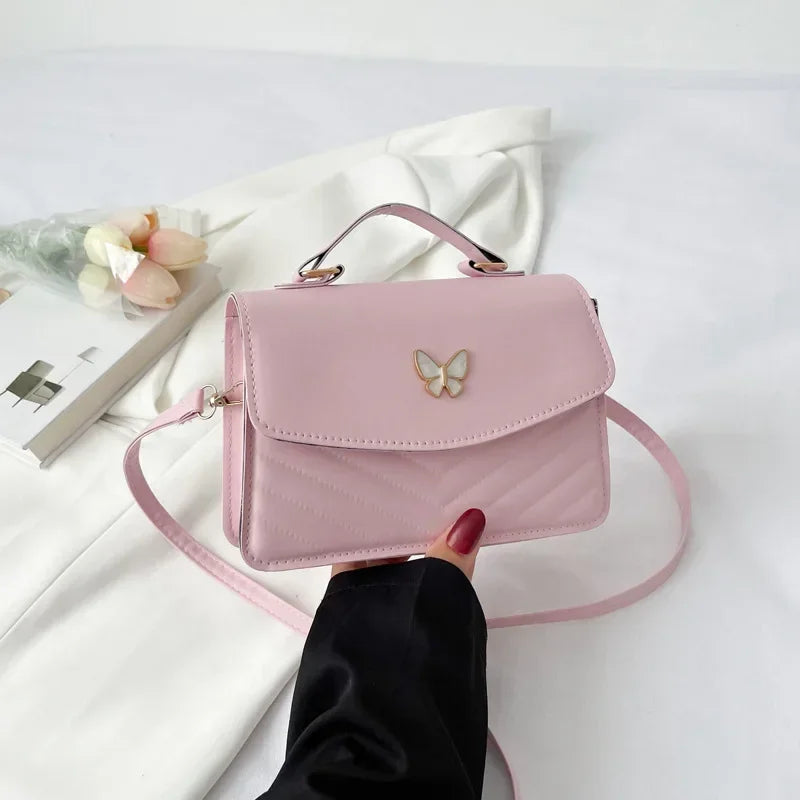 Faux leather bag with butterfly decoration