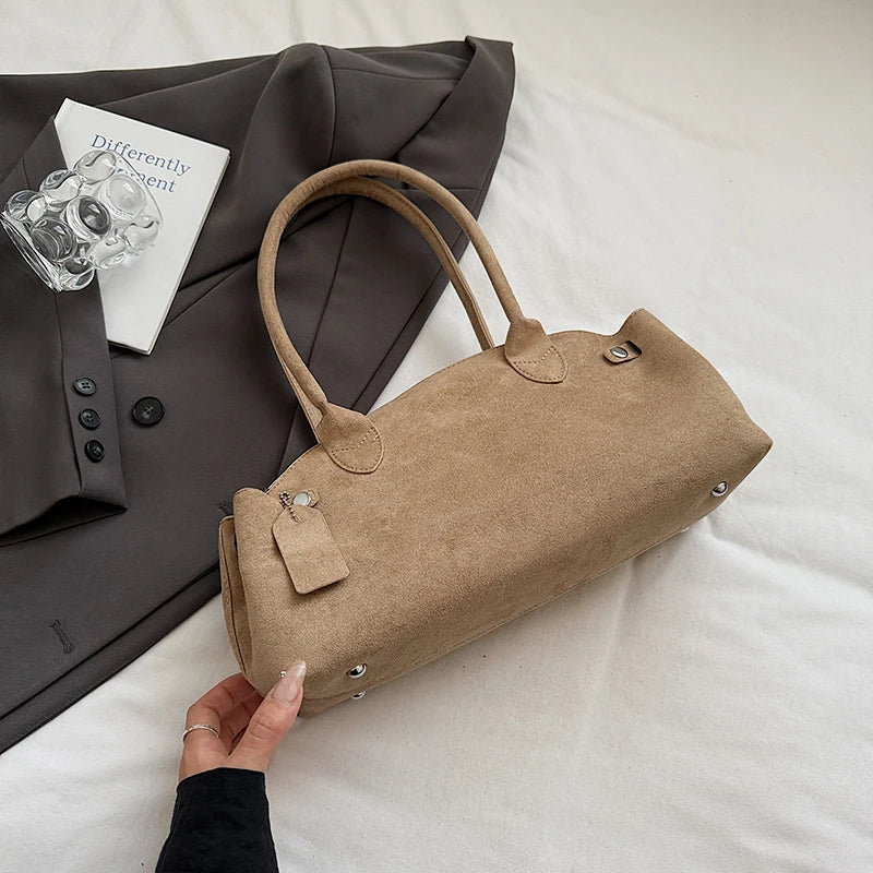 Suede bag with retro design